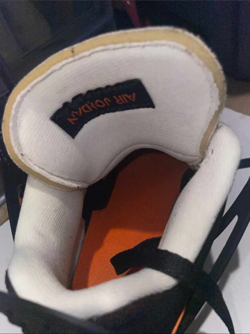 Jordan Black and Orange Low-Top Sneakers